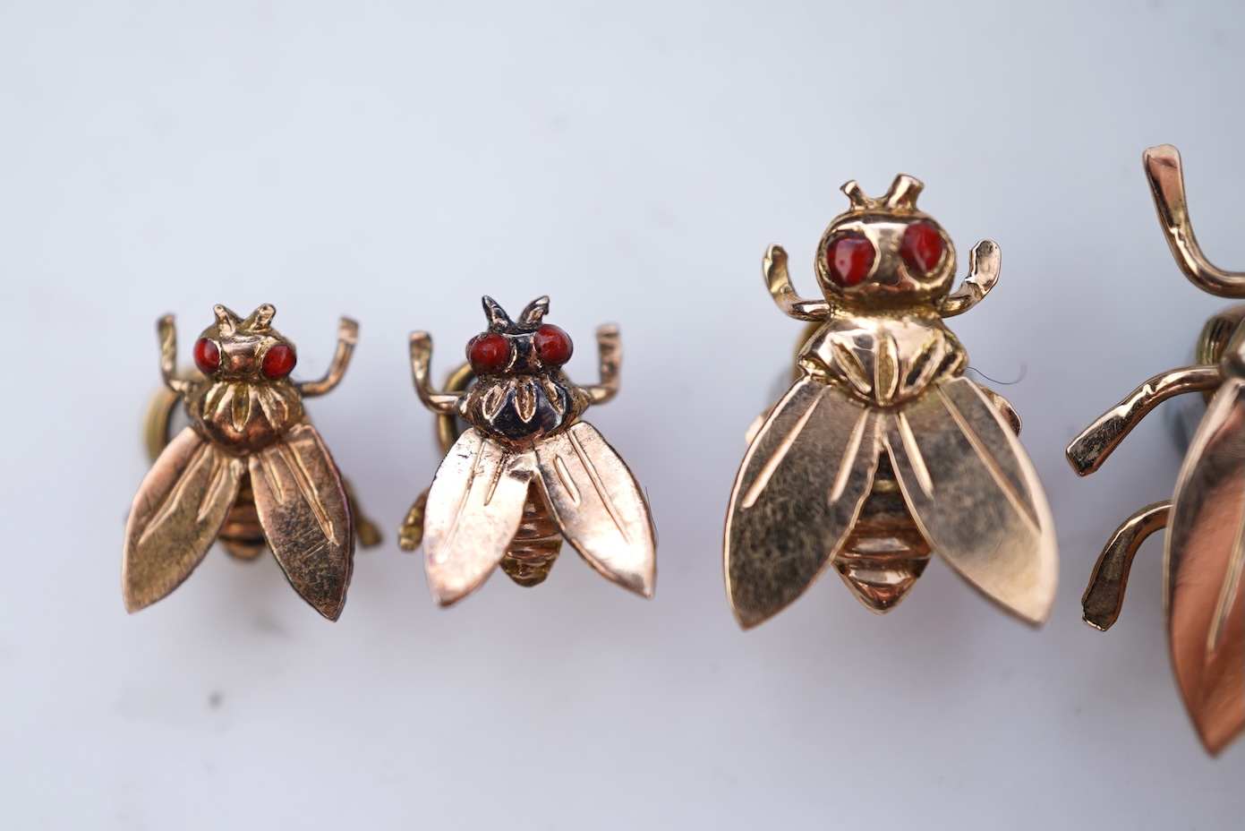 A set of four Retro gold and enamel buttons, mid 20th century